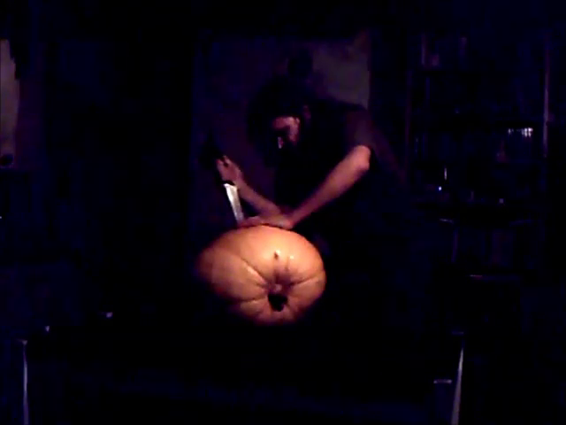 cutting a pumpkin