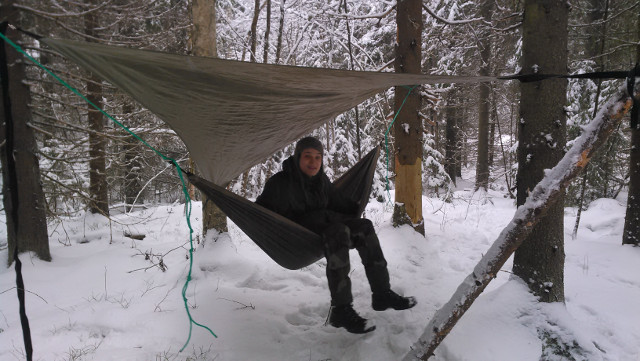 a hammock with a rain cover