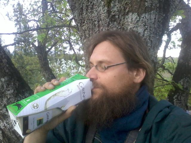 Sipping wine.