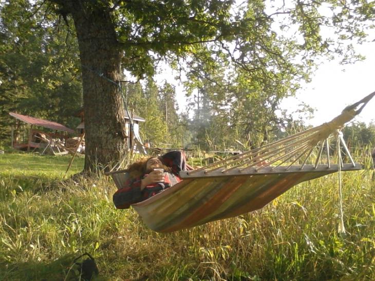Enjoying coffee in a hammock.